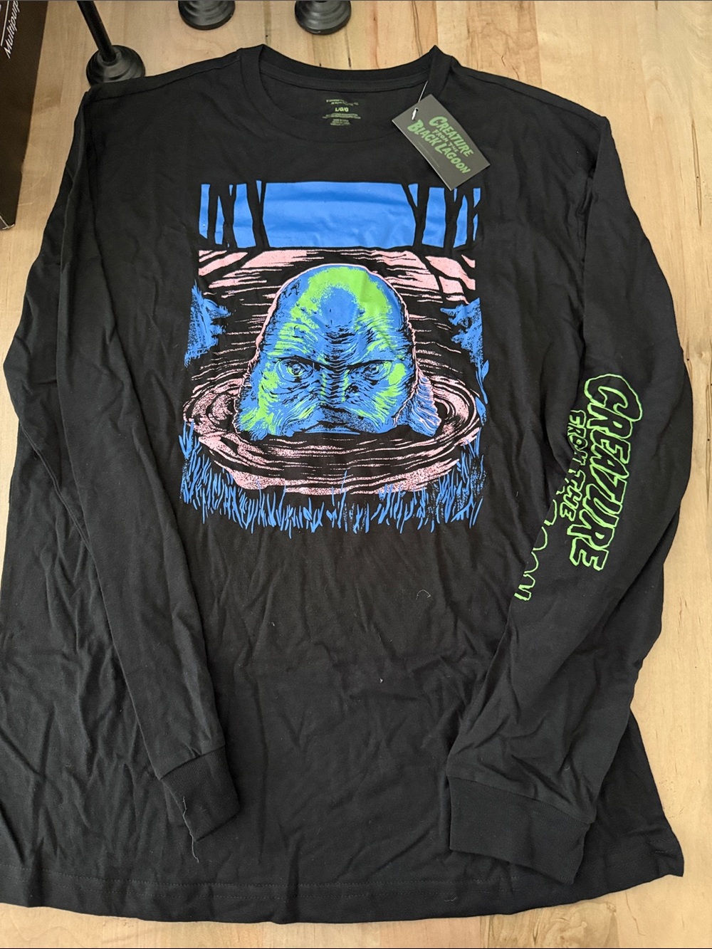 Universal Black Long-Sleeve Tee with Neon Creature Graphic